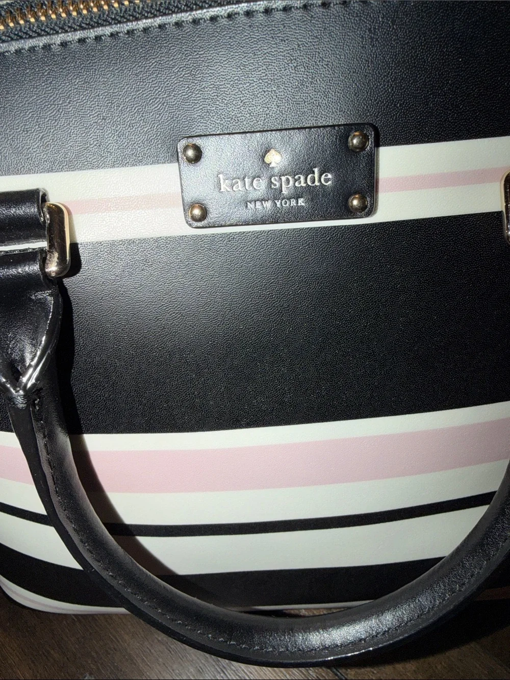 Kate Spade Grove Street Carli Satchel features a classic look
